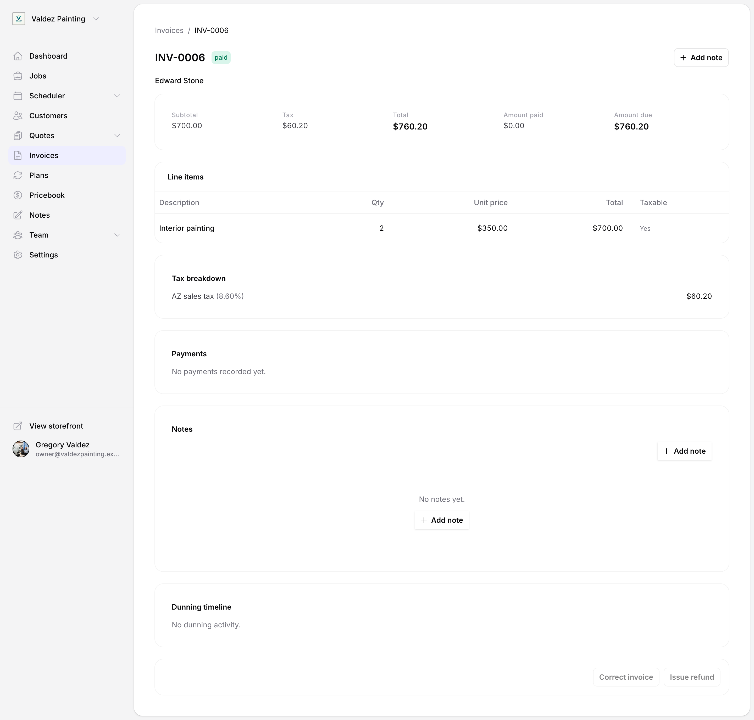 Invoice detail page for a paid invoice showing subtotal, tax, and total summary, a line item with tax breakdown, and action buttons at the bottom